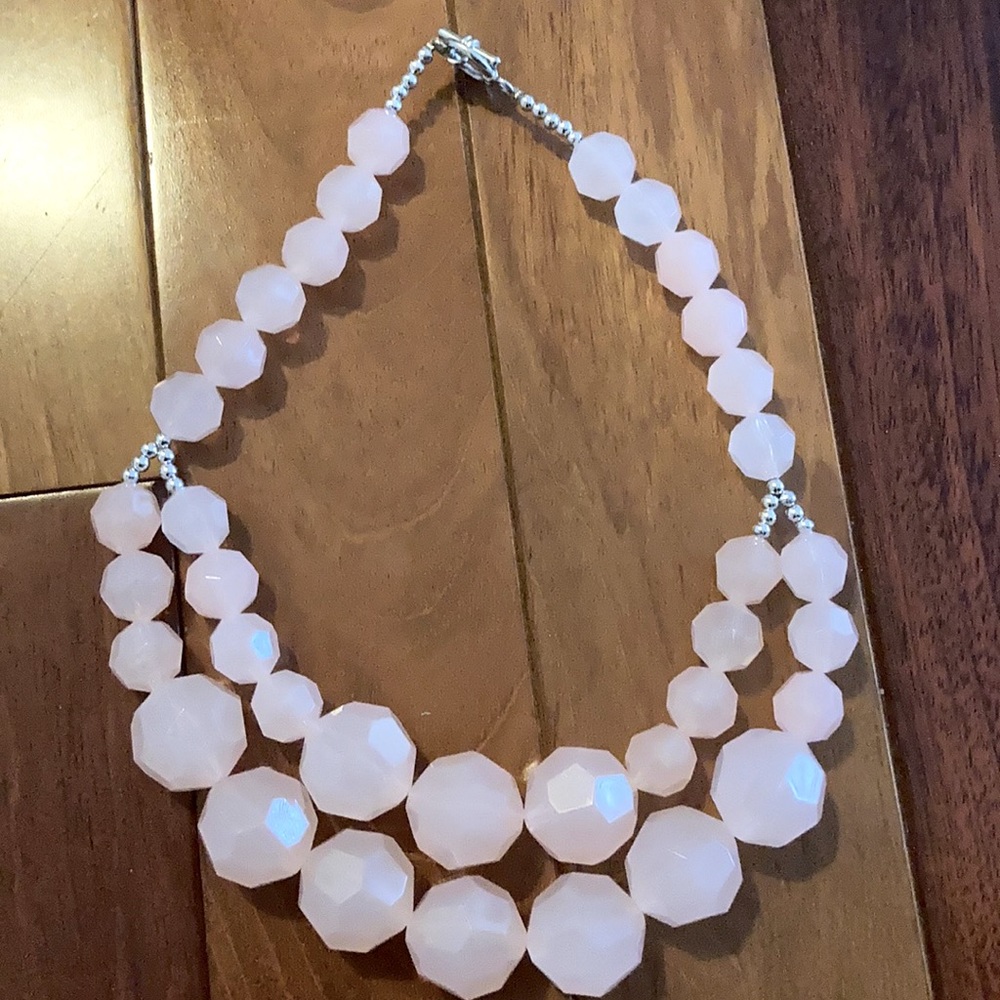 Light pink necklace.